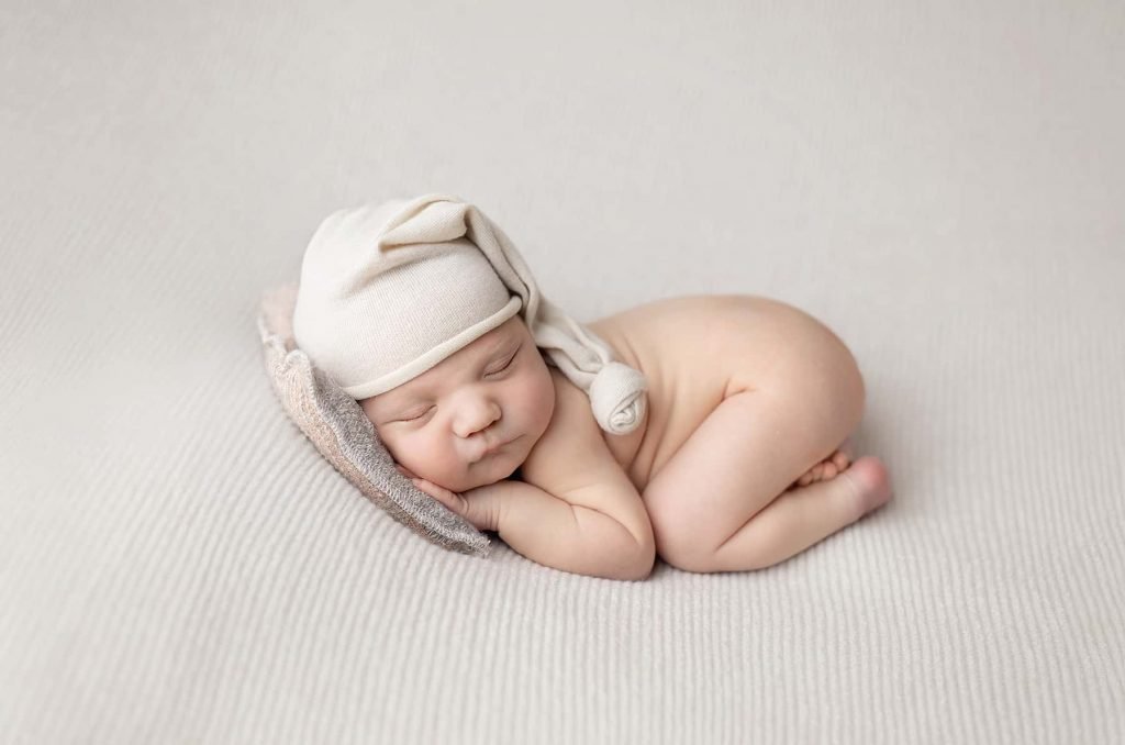 baby photography Sydney newborn is sleeping on a white background