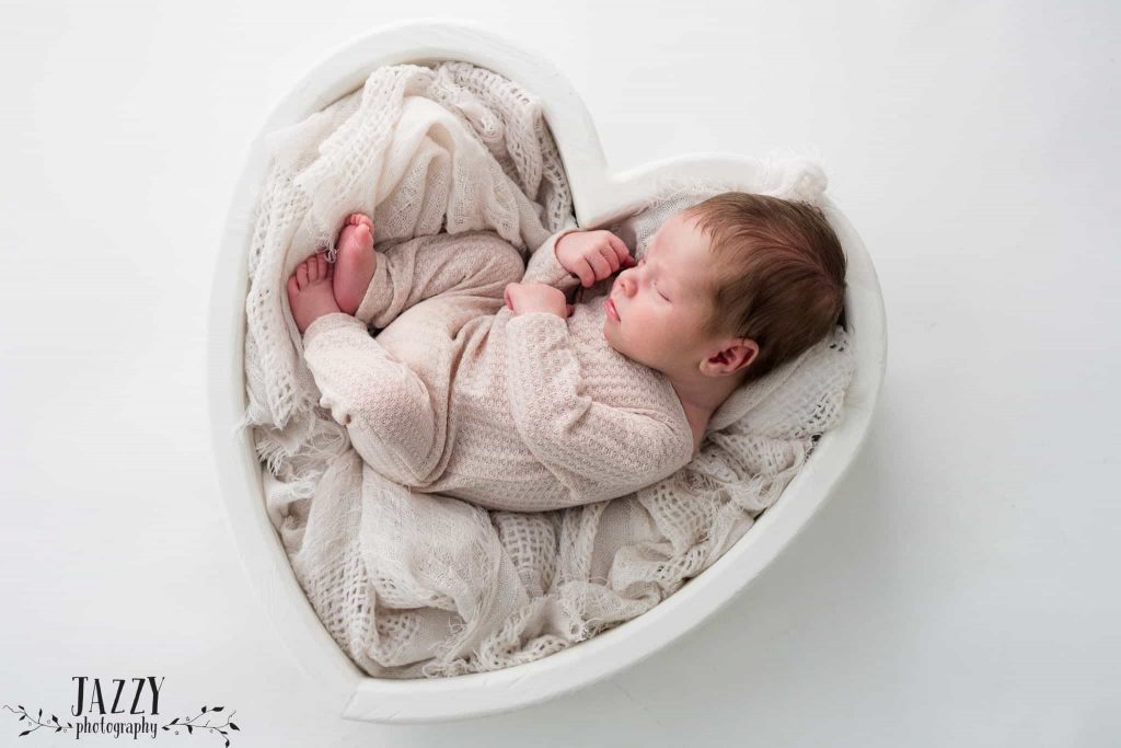 baby photoshot Sydney baby is sleeping in a heart shaped cot 