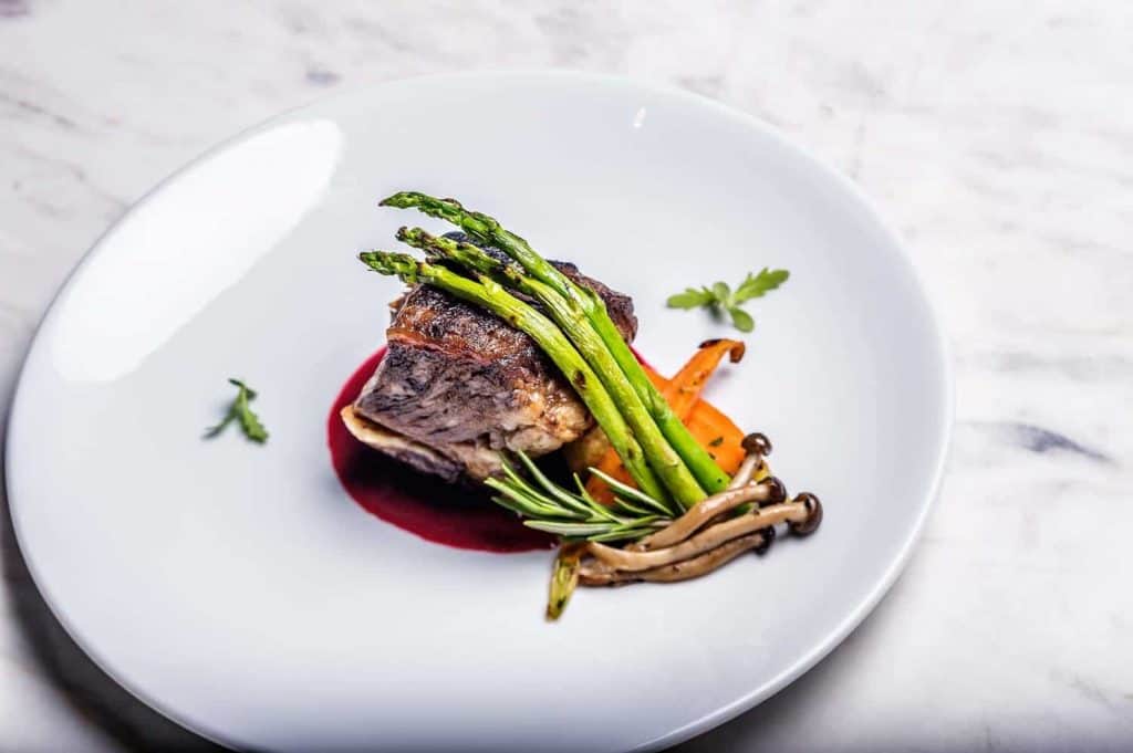 food photographers london a piece of meat with asparagus and enoki mushrooms
