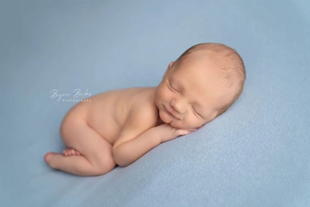 newborn photographer Sydney baby is sleeping on a blue blanket