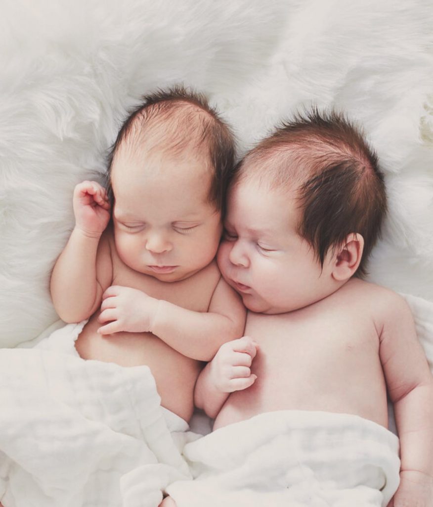 newborn photographer Sydney twins are cuddling and sleeping peacefully
