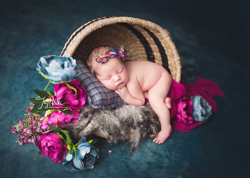newborn photographer Sydney baby is sleeping with a floral headband
