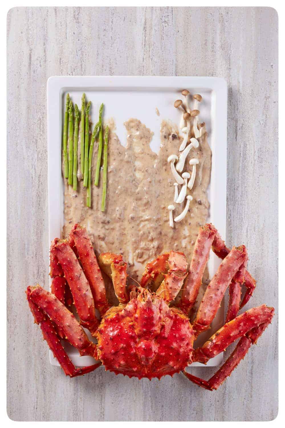 food stylist singapore the crab is laid out with asparagus and enoki mushrooms