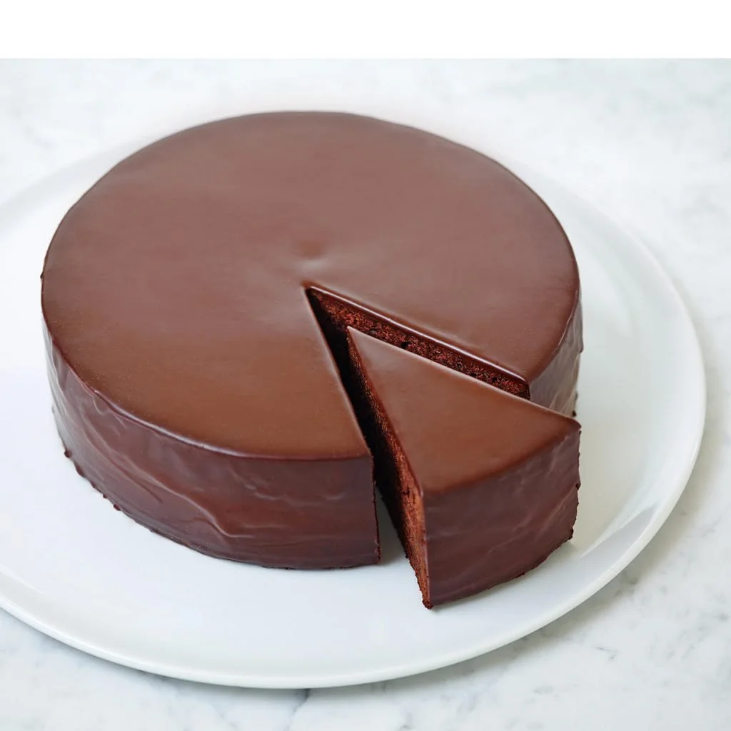 dessert photography a chocolate cake with one slice cut out