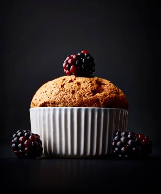 food photography dessert a muffin with three raspberries