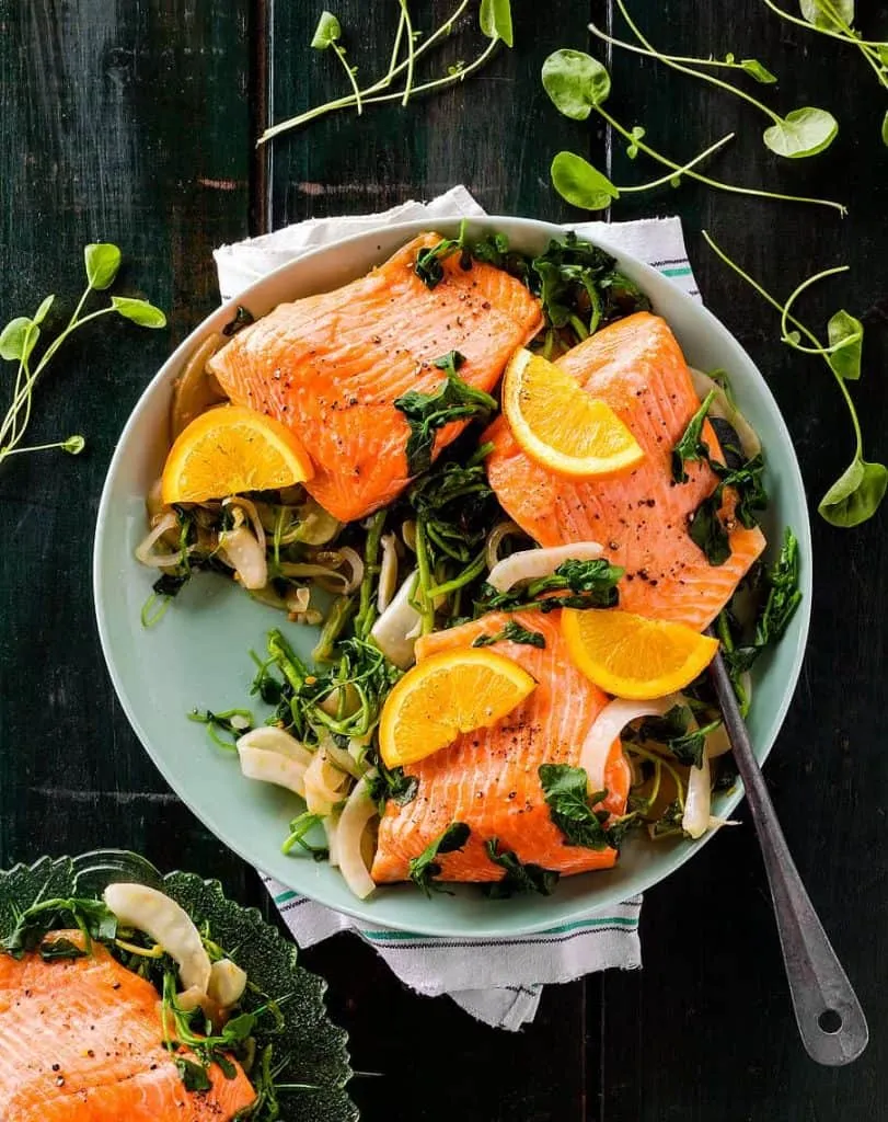Salmon and greens dish captured by food photographers in Toronto.