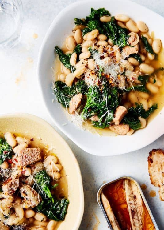 Two bowls of white bean soup with sausage and kale photographed for food photographers in Toronto.
