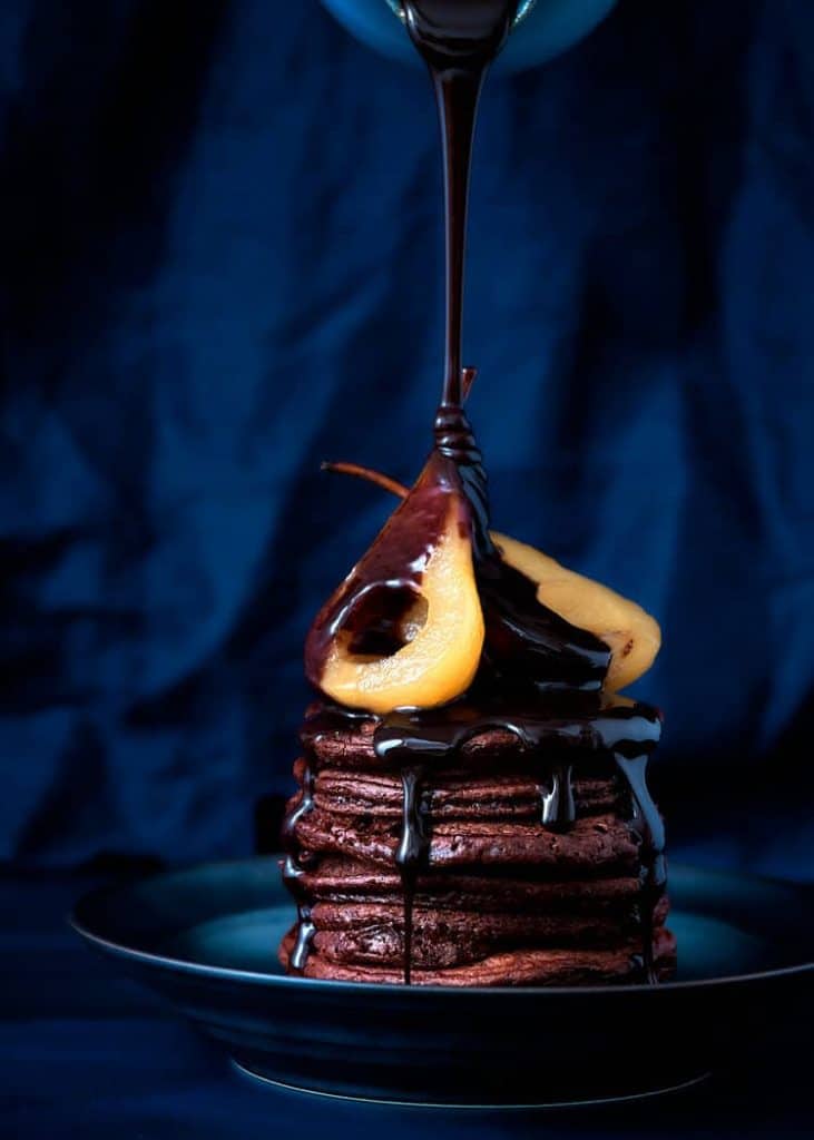 A stack of pancakes with a chocolate drizzle, perfect for food photographers in Toronto.