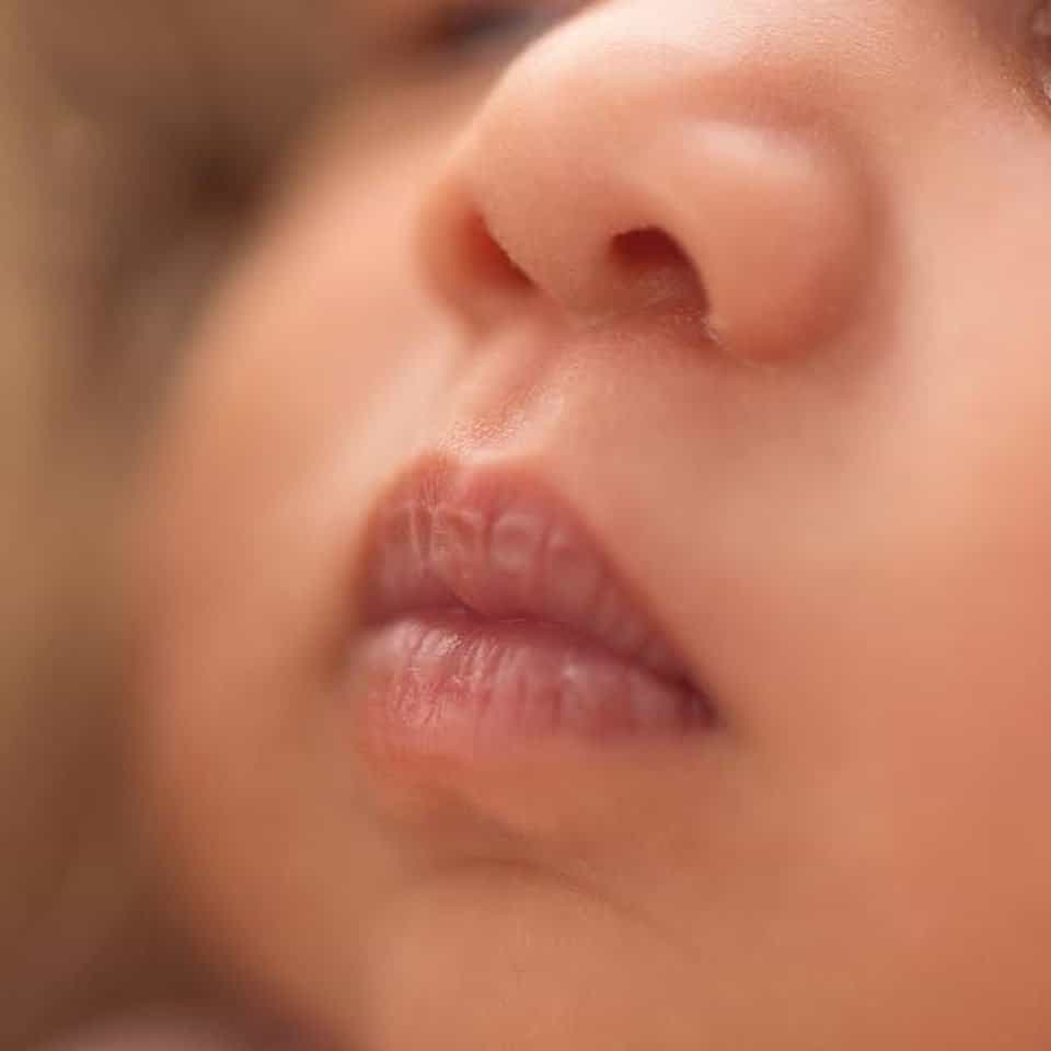 Close up of a baby's nose captured by newborn photographers in Toronto.