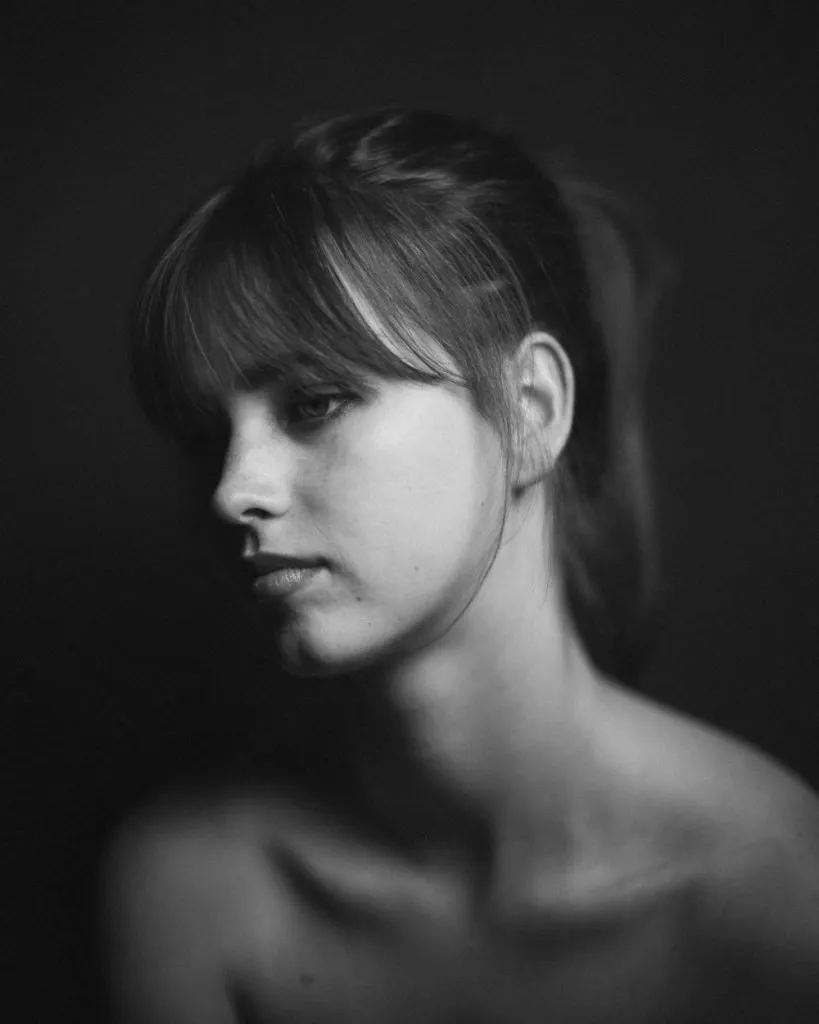 A black and white photo of a woman by portrait photographers in London.